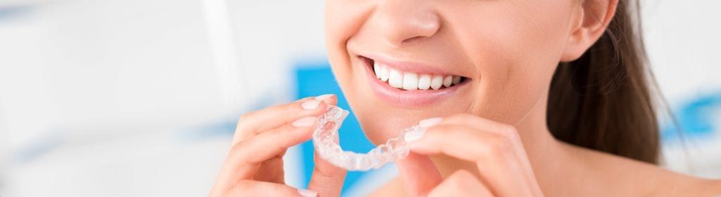 Woman with clear aligner